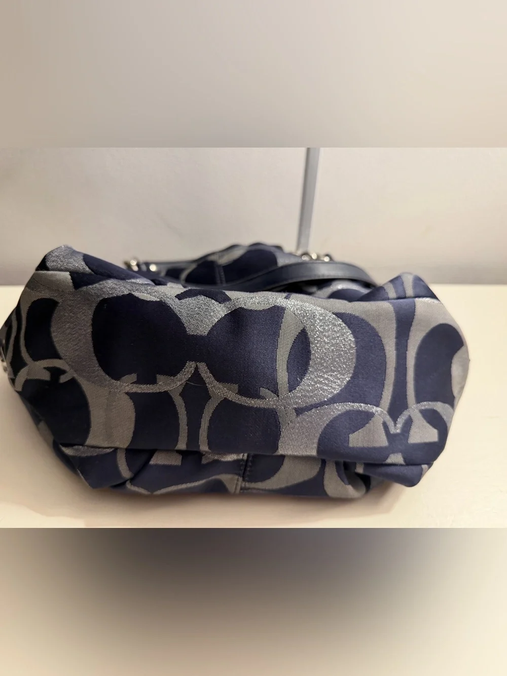 Coach navy , gray & metallic silver signature jacquard with navy leather trim.